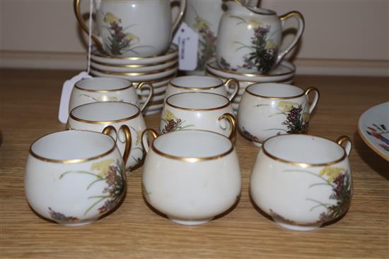 A Japanese Satsuma part coffee service, decorated with flowers and heightened in gilt, comprising coffee pot, cream jug,